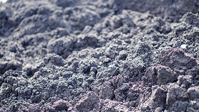 Dewatered sludge cake from wastewater treatment with reduced volume for lower transport and disposal costs.